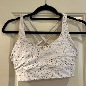 White zyia sports bra and leggings with gold flecks